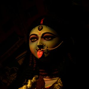 A striking statue of Goddess Kali with vivid colors and traditional adornments in Kolkata.